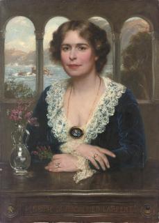 Frank Moss Bennett - Portrait of Penrose de Hochepied Larpent, half-length, in a blue velvet dress with lace collar and cuffs, seated at a wooden table, a landscape beyond