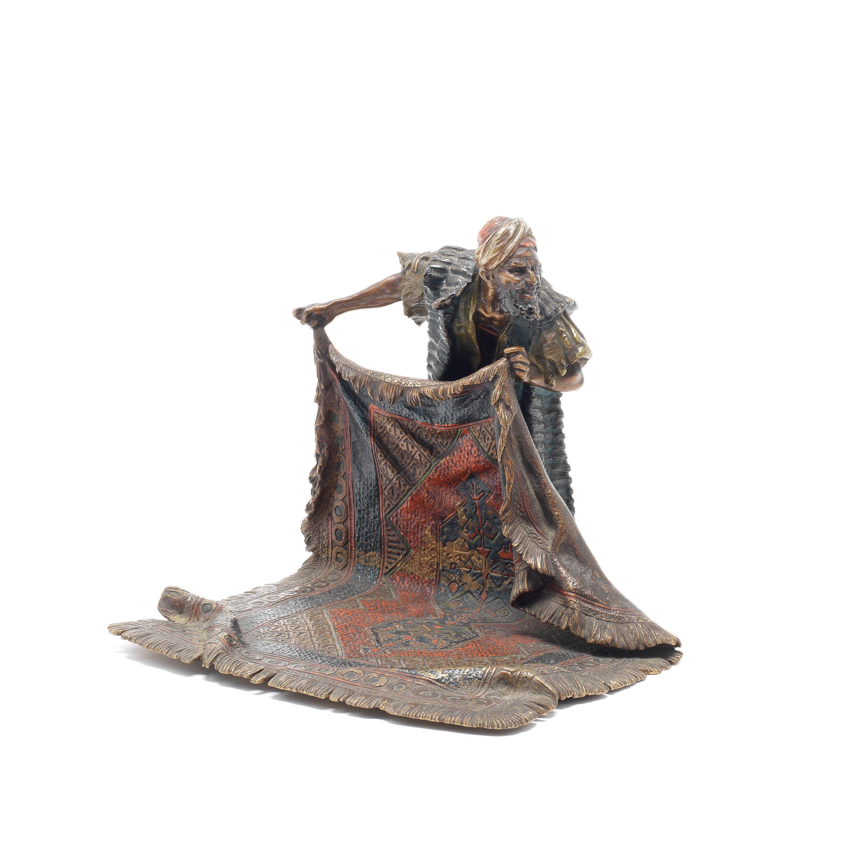 Franz Bergman - A cold painted bronze of an Arab carpet seller