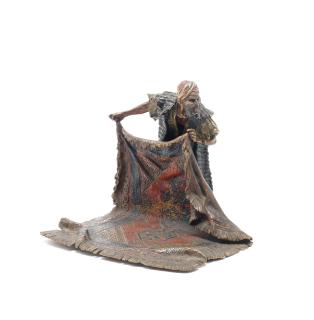 Franz Bergman - A cold painted bronze of an Arab carpet seller