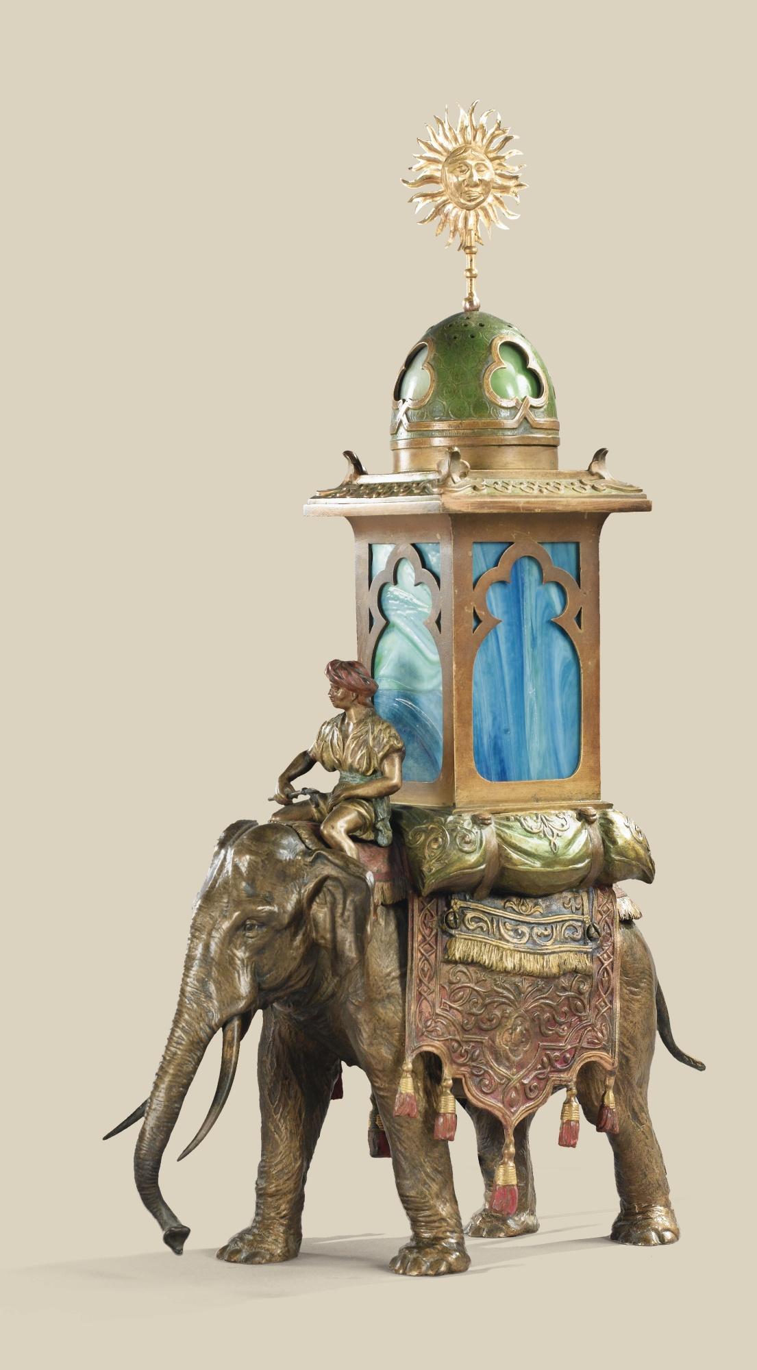 Franz Bergman - An Austrian, 19Th Century, Polychromed Cold Painted Bronze And Coloured Glass Lamp With An Elephant Carrying A Man And A Howdah Lamp, By Franz Bergman (1838-1894)
