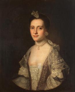 George Romney - Portrait of Miss Mary Barnes (1745-1822), half-length, in a blue dress with white lace trim, within a painted oval