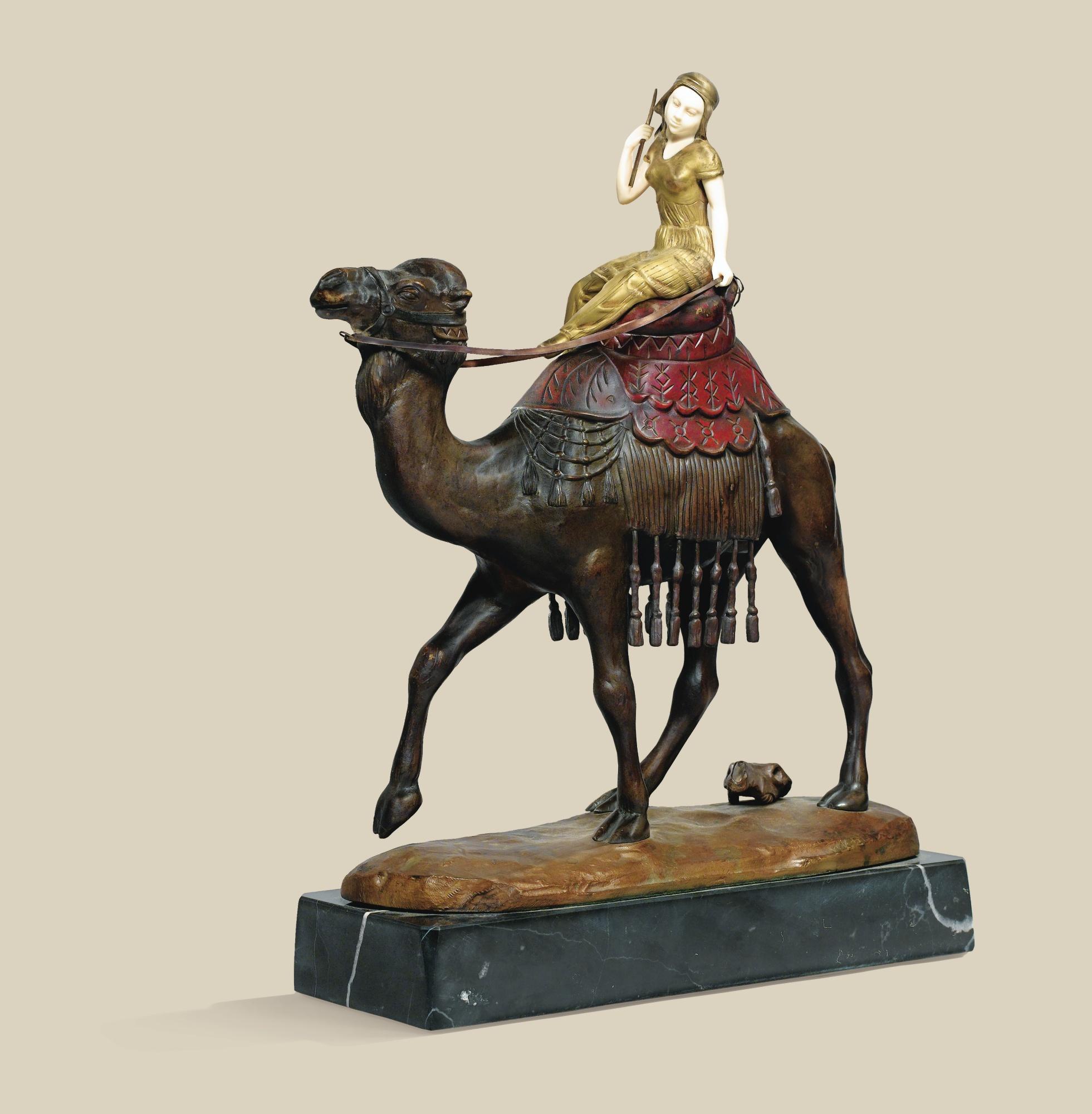 Georges Morin - A German, 20Th Century, Polychromed Cold Painted Bronze And Ivory Female Camel Rider On A Black Marble Base, By Georges Morin (1874-1950)