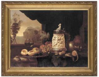 Gyula Bubárnik - A röemer, peaches, grapes, walnuts, oranges, a mid-17th century German silver-mounted ivory tankard, with a jug to the side, an extensive landscape beyond