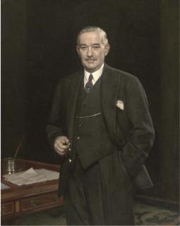 Harold Knight, R.A., R.O.I. - Portrait of H. J. Mitchell, Three-Quarter-Length, In A Dark Suit, Holding Glasses In His Right Hand, Beside A Desk