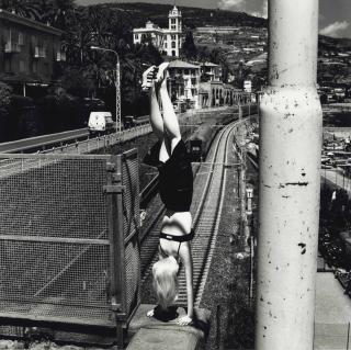 Helmut Newton - Dangerous Legs, Woman doing handstand, Bordighera, 1996