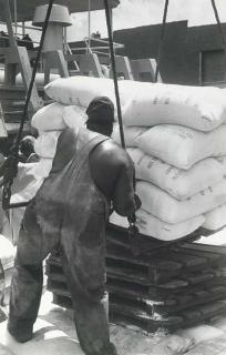 Henri Cartier-Bresson - Untitled (Stevedore loading flour bags, Catholic Relief to Inchon, Korea), mid-1950s