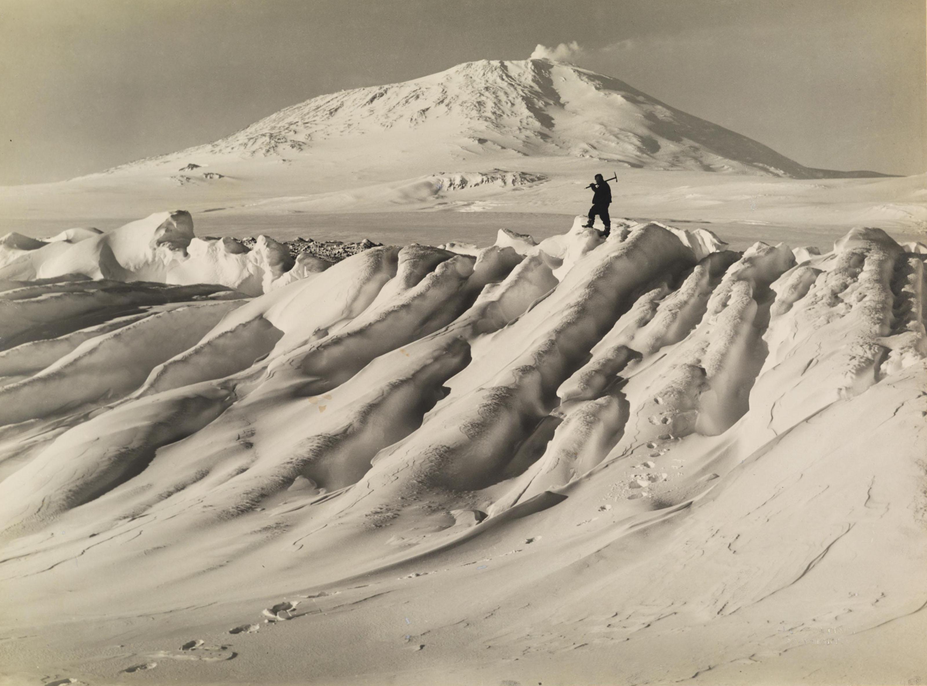 Herbert G. Ponting - Mount Erebus Seen Over a Water-Worn Iceberg, c. 1911