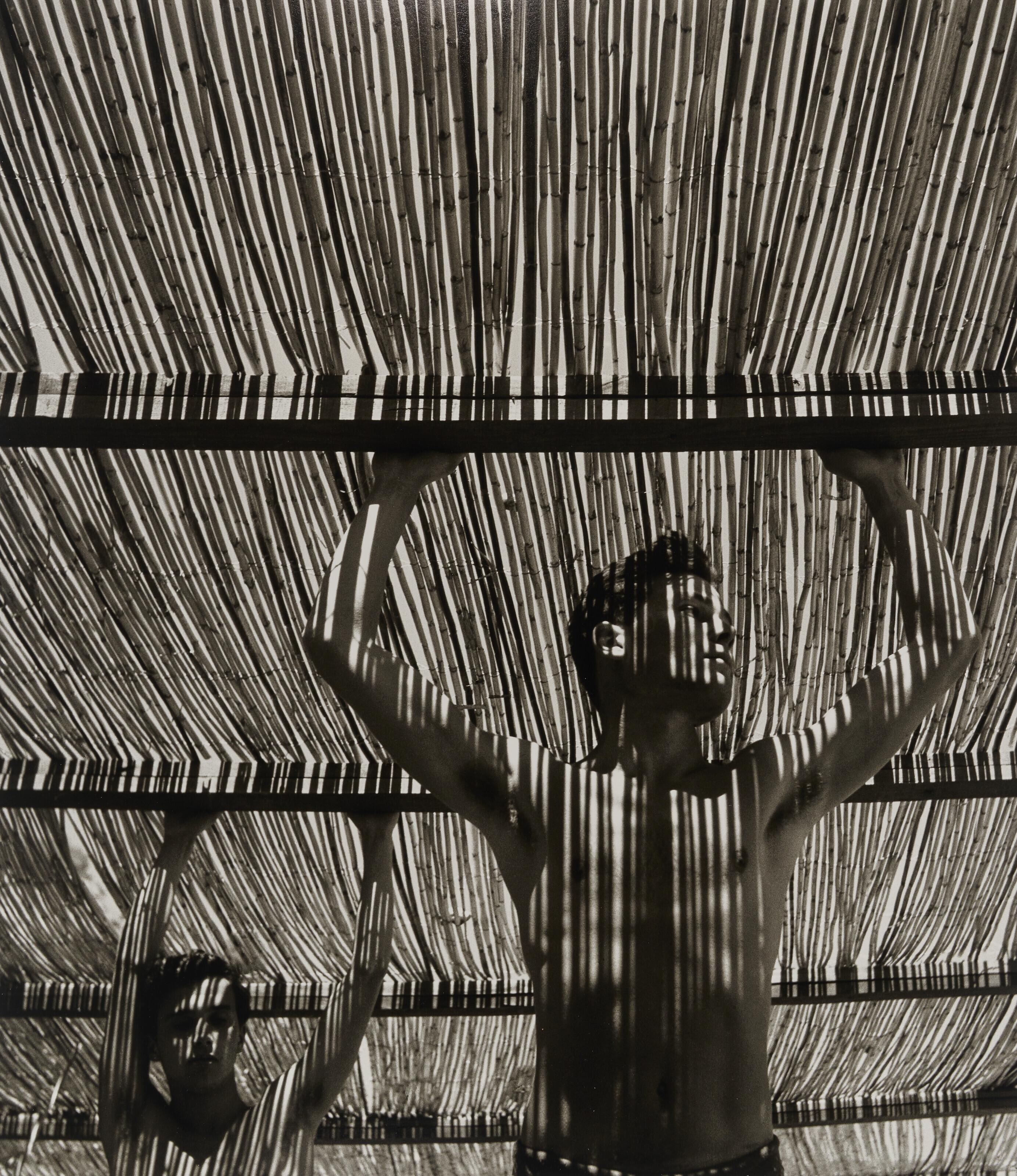 Herbert List - Young Men Under Reed Roof, Torremolinos, 1951