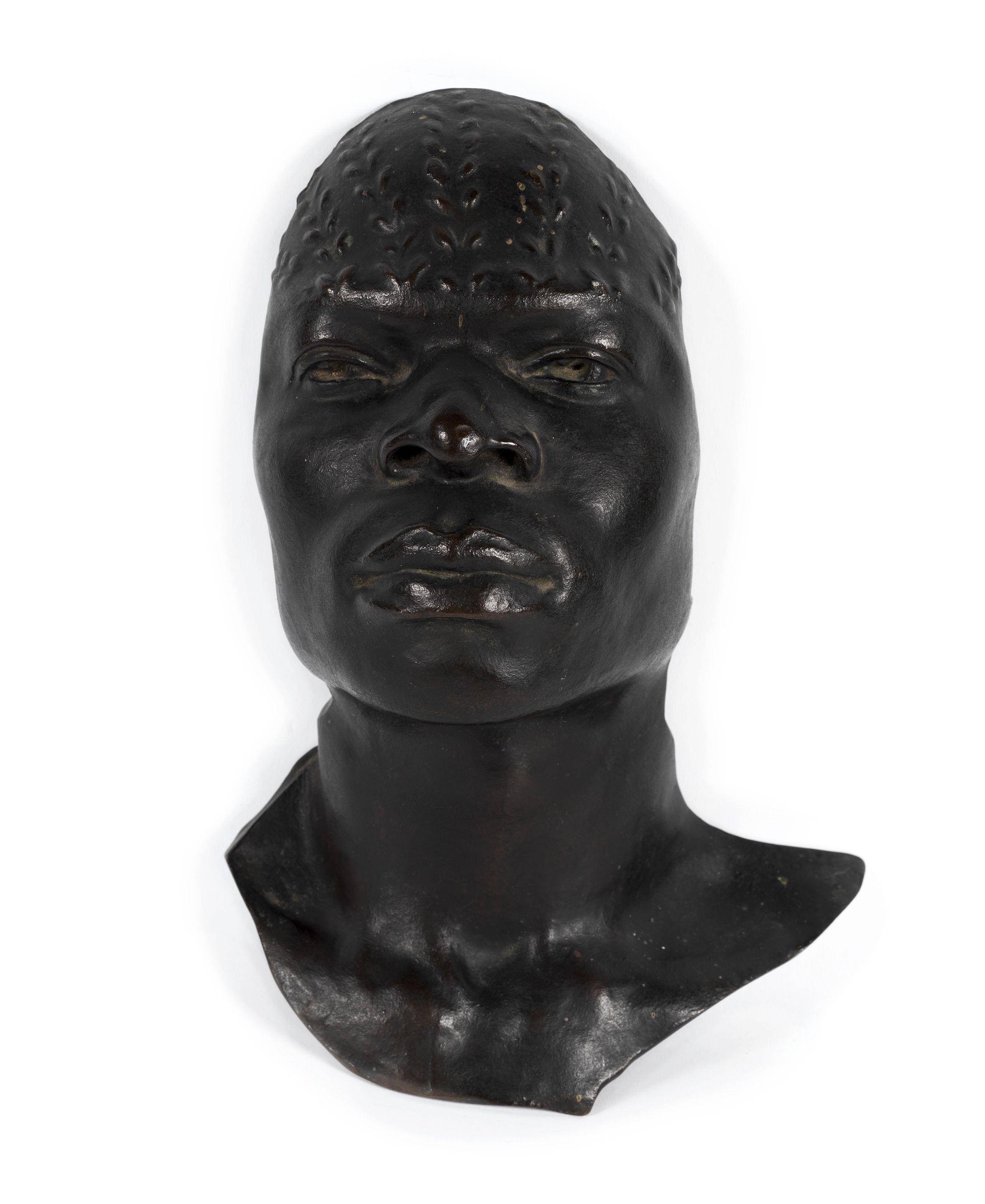 Herbert Ward - A patinated bronze of a native African man, modelled as a mask the forehead with scarification marks