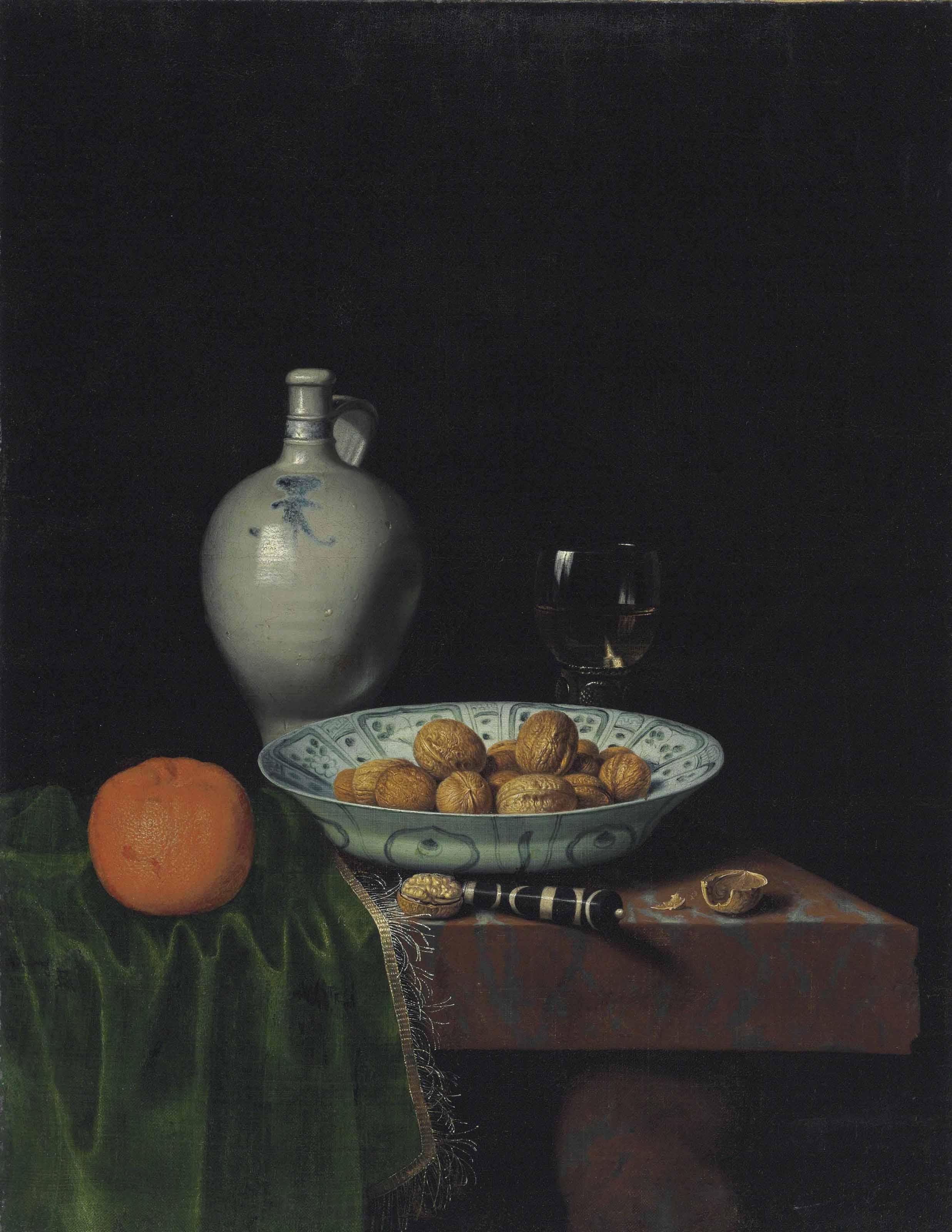 Hubert Van Ravesteyn - Walnuts in a wan-li porcelain bowl, an orange, a stoneware jug, a knife, and a roemer filled with wine on a partially draped marble table