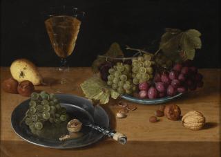 Isaac Soreau - A porcelain plate with red and green grapes, a pewter plate with a knife, nuts, a pear and a glass of wine on a table top