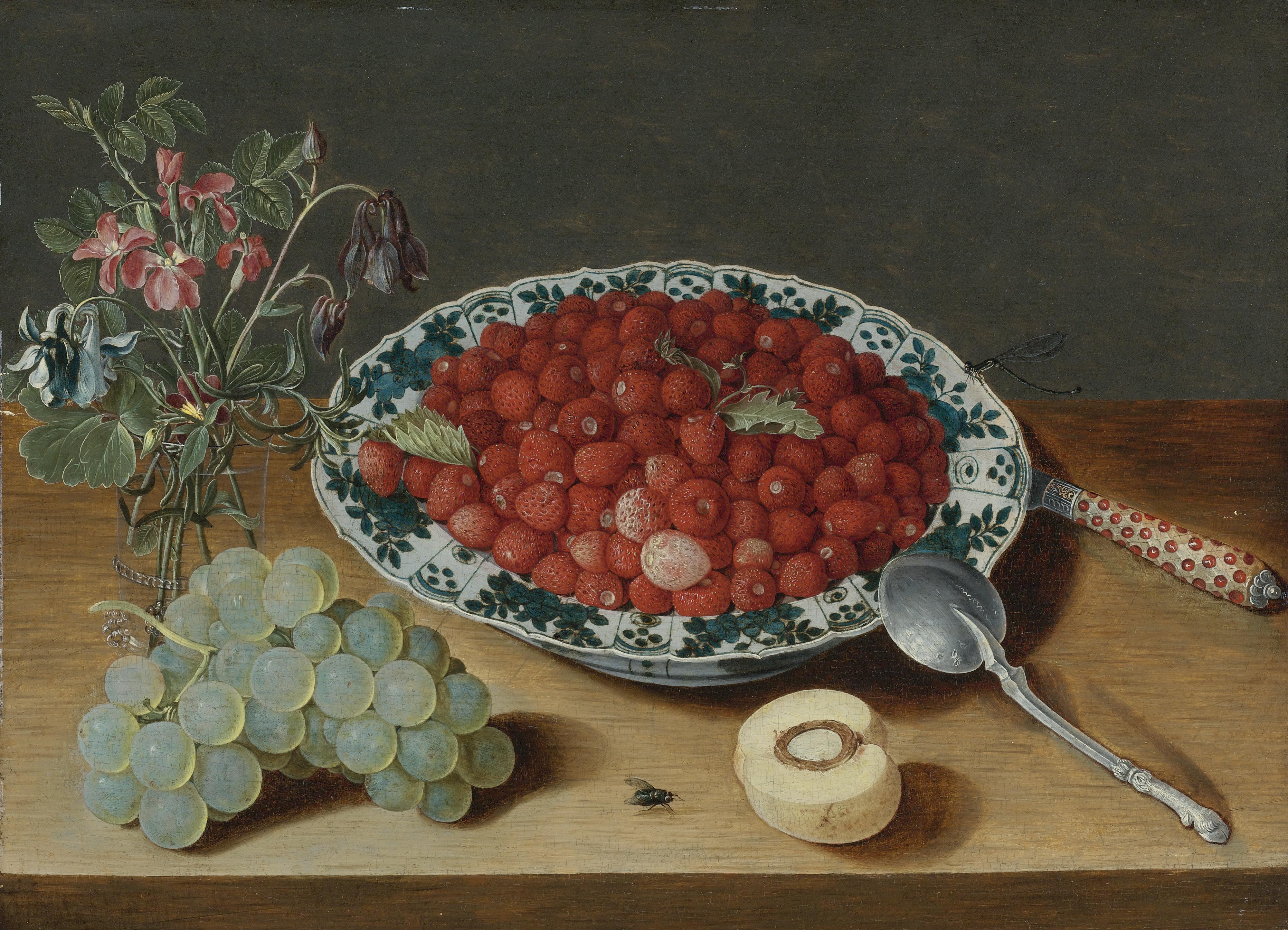 Isaak Soreau - A Still Life With Strawberries In A Wan-Li Porcelain Bowl, A Bunch Of Grapes, A Glass Vase With Columbines And Eglantine, A Silver Spoon, An Inlaid Knife And A Half Peach With A Fly And Dragon Fly On A Wooden Table Top