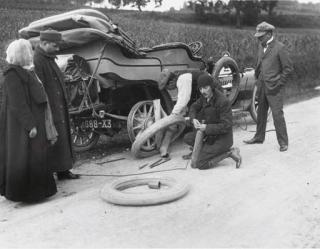 Jacques-Henri Lartigue - Changing a tire; and Untitled (two women motoring), 1911