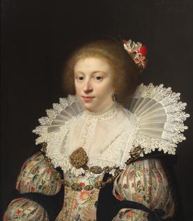 Jan Anthonisz. van Ravesteyn - Portrait of a lady, bust-length, in an embroidered dress and with honeysuckle in her hair