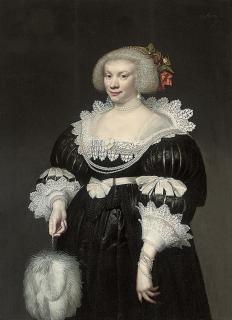 Jan Anthonisz. Van Ravesteyn - Portrait of a lady, three-quarter length, in a black slashed silk dress with lace collar and cuffs, a fan in her right hand
