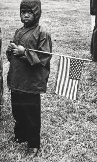 Jill Freedman - Untitled (Boy with flag), Resurrection City, Poor People\'s Campaign, Washington, DC