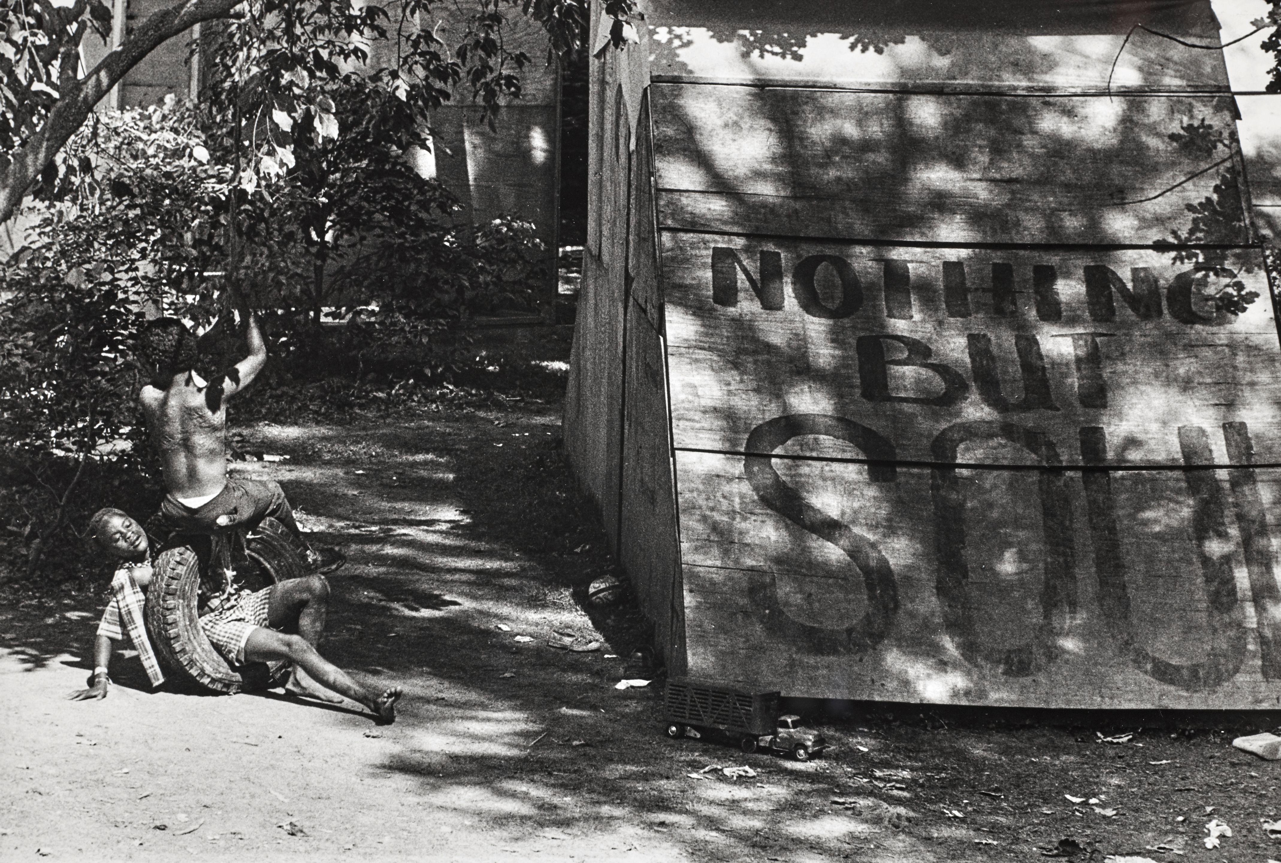 Jill Freedman - Untitled (Boys playing with tire, \