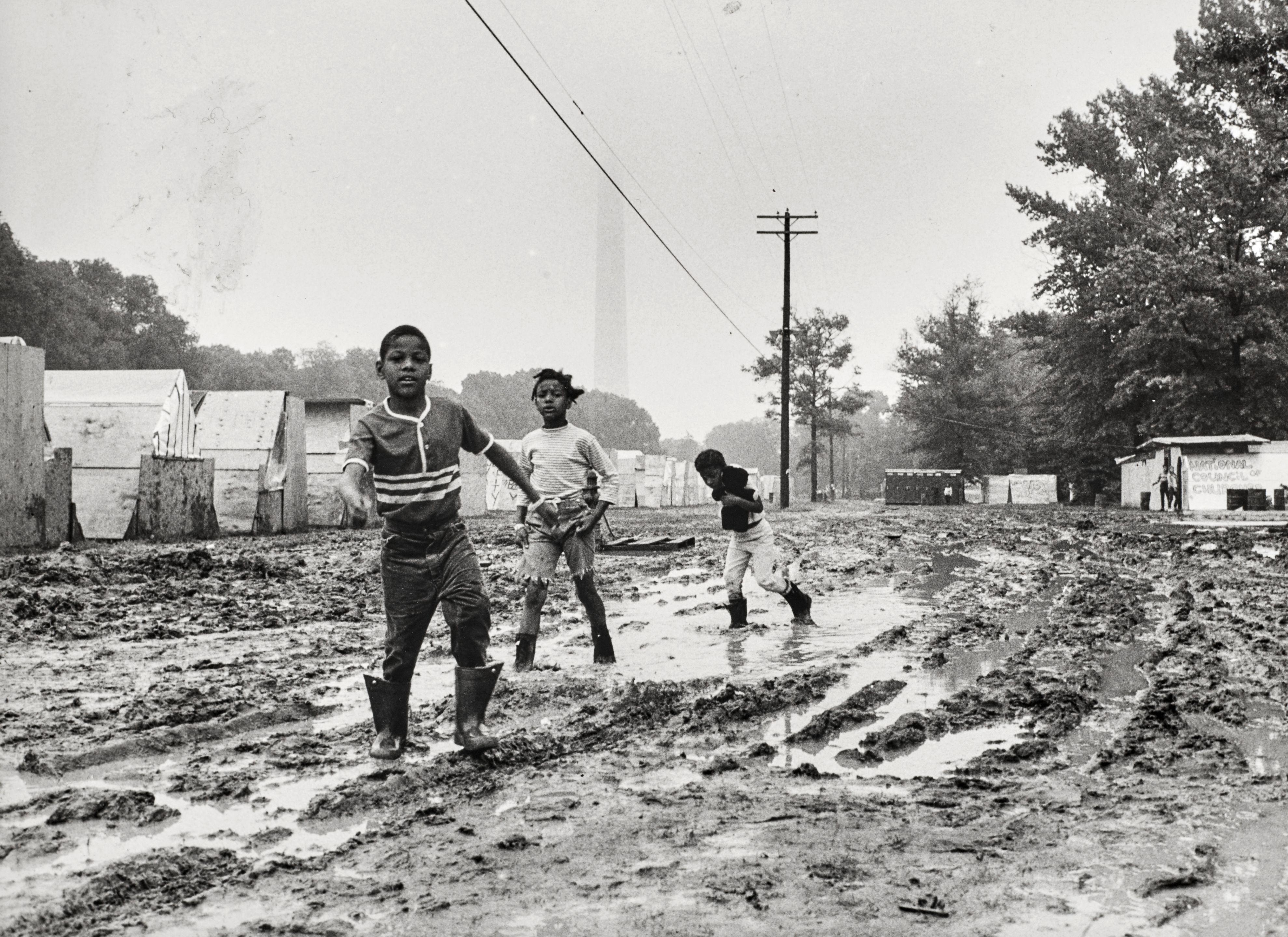 Jill Freedman - Untitled (Children playing in mud), Resurrection City, Poor People\'s Campaign, Washington, DC