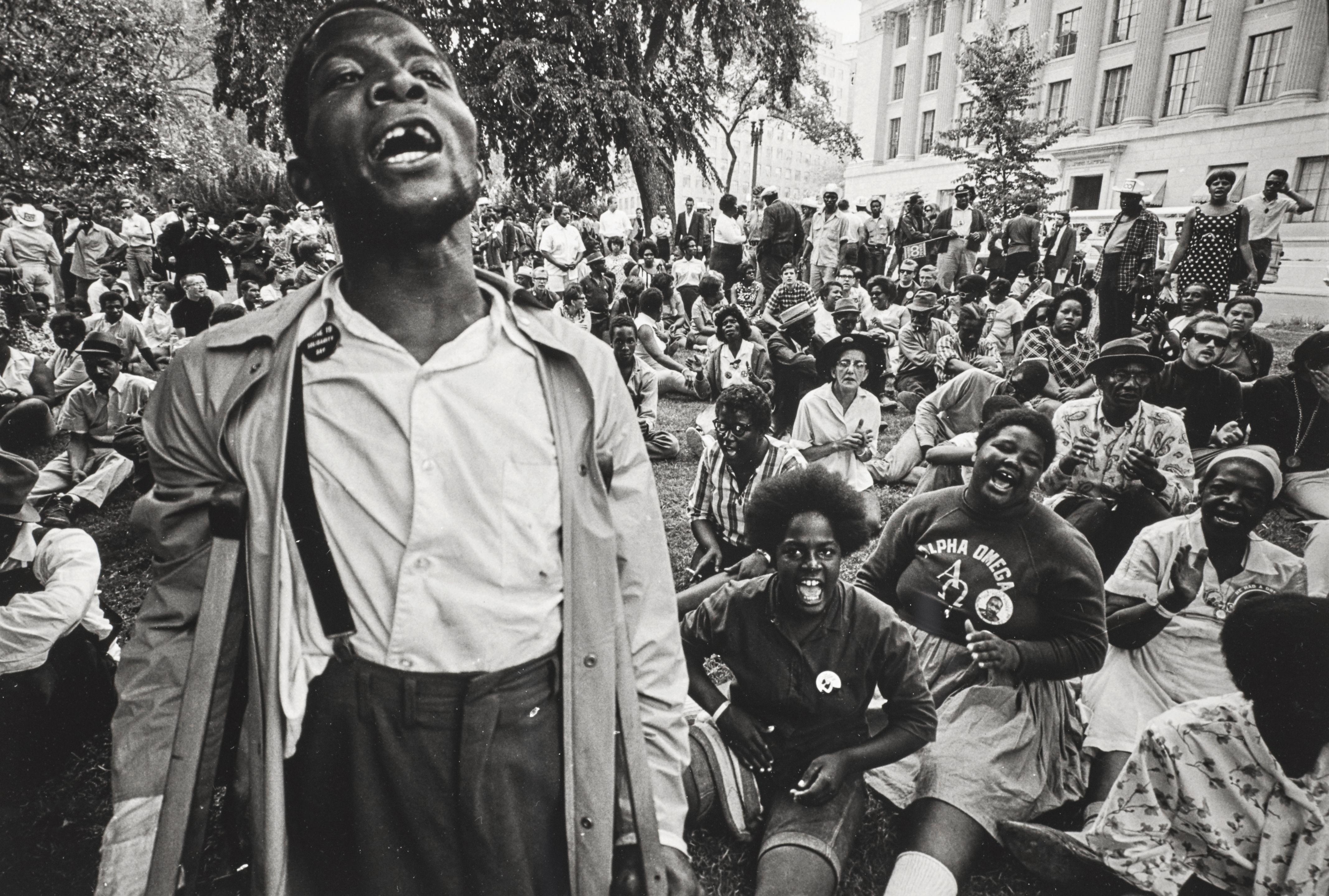 Jill Freedman - Untitled (Young Man with crutches singing to crowd), Resurrection City, Poor People\'s Campaign, Washington, DC