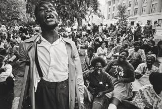 Jill Freedman - Untitled (Young Man with crutches singing to crowd), Resurrection City, Poor People\'s Campaign, Washington, DC