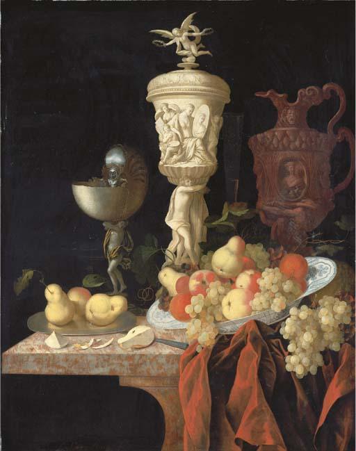 Johann Georg Hinz - A nautilus cup, a sculpted marble urn, a sculpted porphyry jug and other vessels with oranges, apples, pears and grapes in a blue and white porcelain bowl on a partly-draped marble ledge