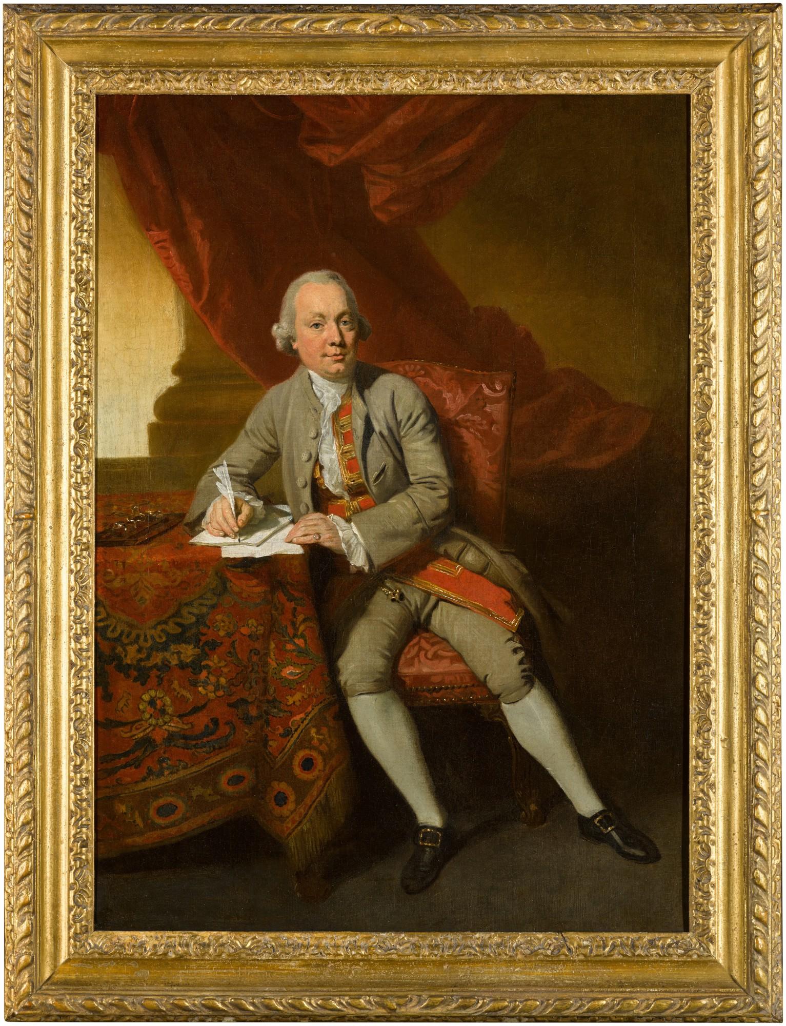 Johann Zoffany R.A. - Portrait of a gentleman, full-length, seated by a table, wearing a coat and breeches with a red and gold waistcoat, holding a quill