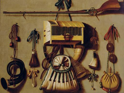 Johannes Leemans - A trompe l\'oeil still life with a gun, a bird in a cage, a hunting horn, gun powder, and other hunting implements hanging on a wall