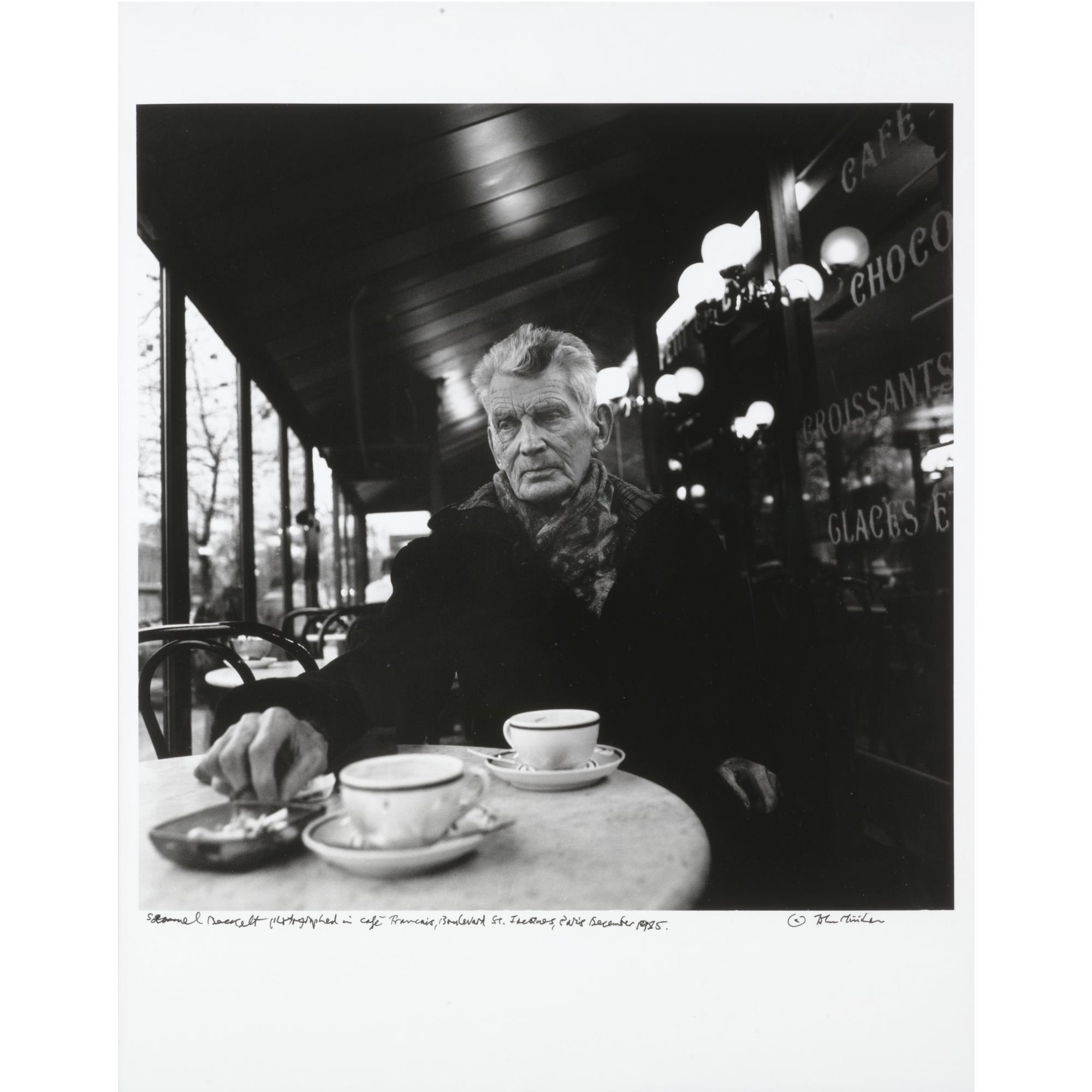 John Minihan - Samuel Beckett Photographed In Café Francais, Boulevard St Jacques, Paris December 1985