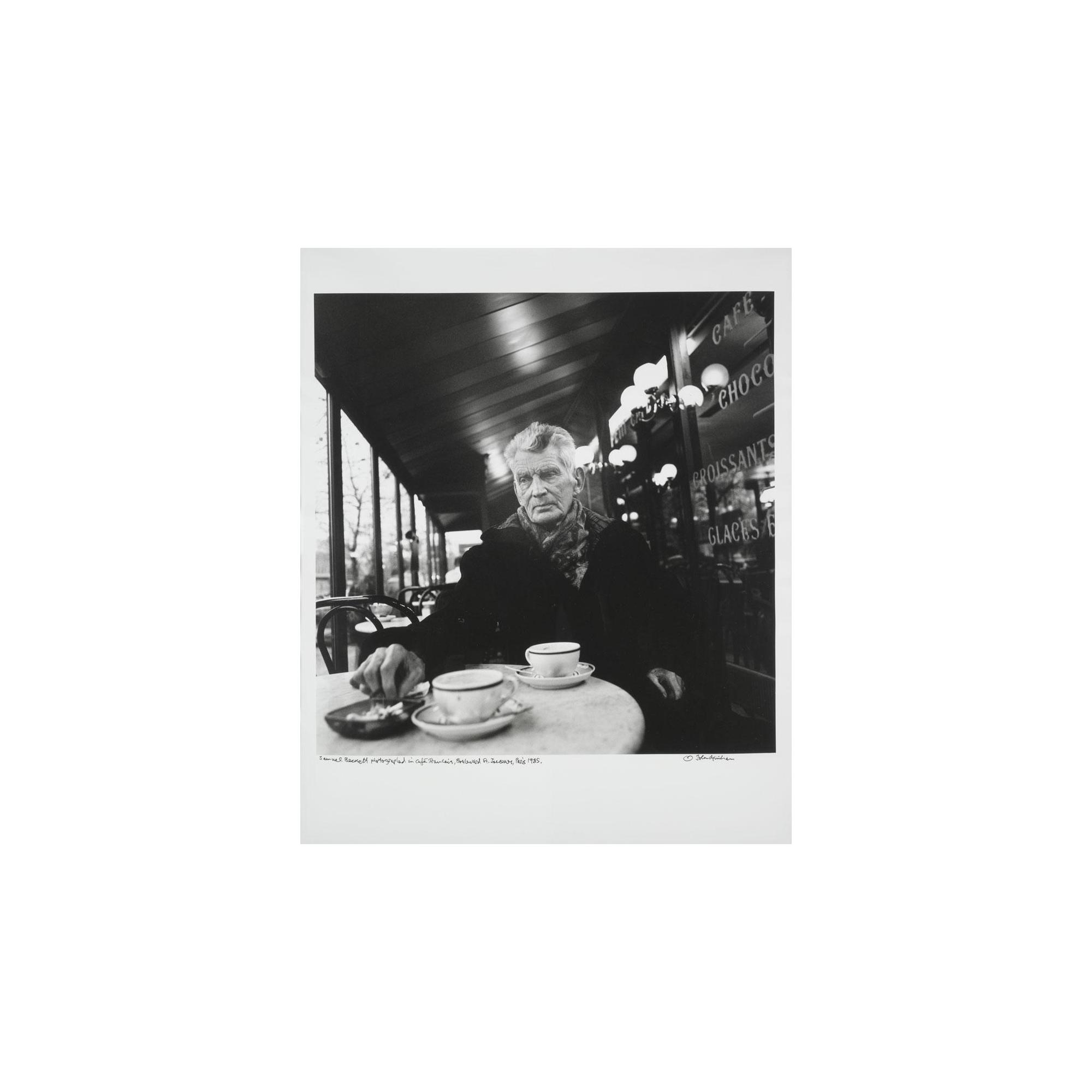 John Minihan - Samuel Beckett Photographed In Café Francais, Boulevard St. Jacques, Paris