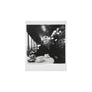 John Minihan - Samuel Beckett Photographed In Café Francais, Boulevard St. Jacques, Paris