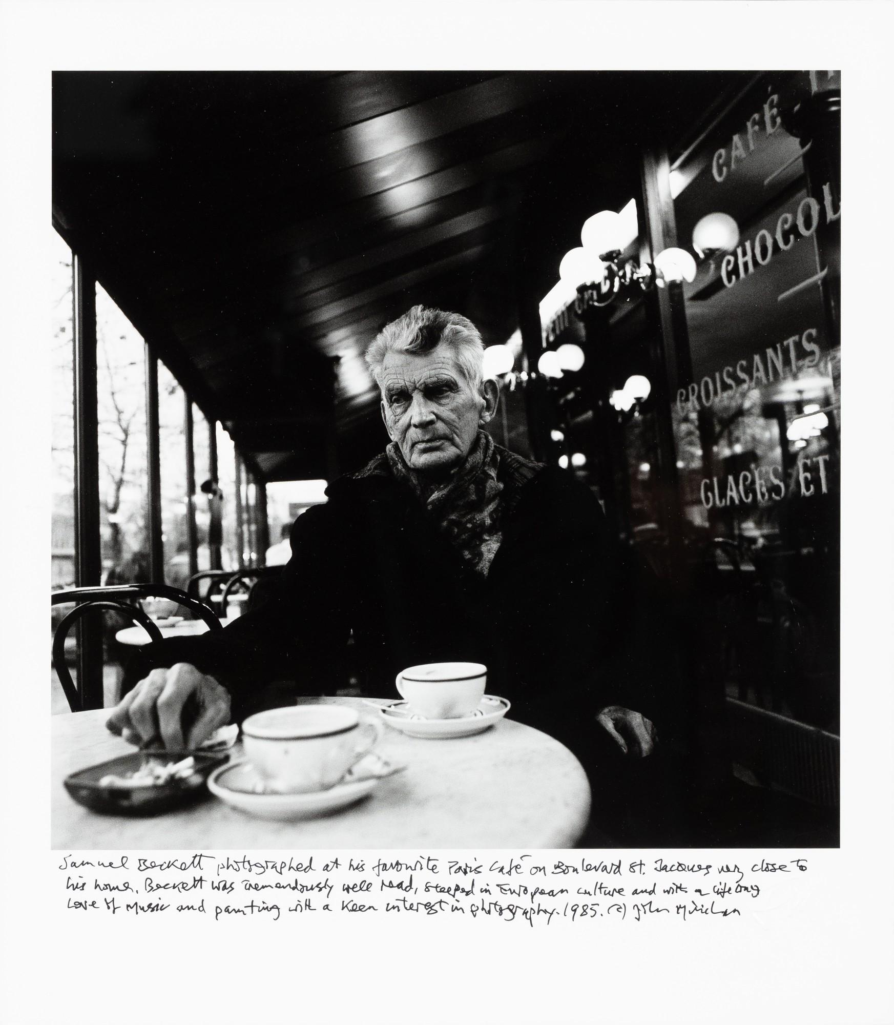 John Minihan - Samuel Beckett Seated in Café Français, Boulevard St. Jacques, Paris, 1985 | Samuel Beckett assis au Café Français, Boulevard St. Jacques, Paris, 1985