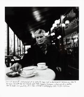 John Minihan - Samuel Beckett Seated in Café Français, Boulevard St. Jacques, Paris, 1985 | Samuel Beckett assis au Café Français, Boulevard St. Jacques, Paris, 1985