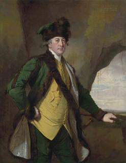 Joseph Wright of Derby, A.R.A - Portrait of John Whetham (1731-1781), of Kirklington, three-quarter-length, in a bottle-green fur-lined jacket, yellow waistcoat and fur hat, a spear in his left hand, in a rocky landscape
