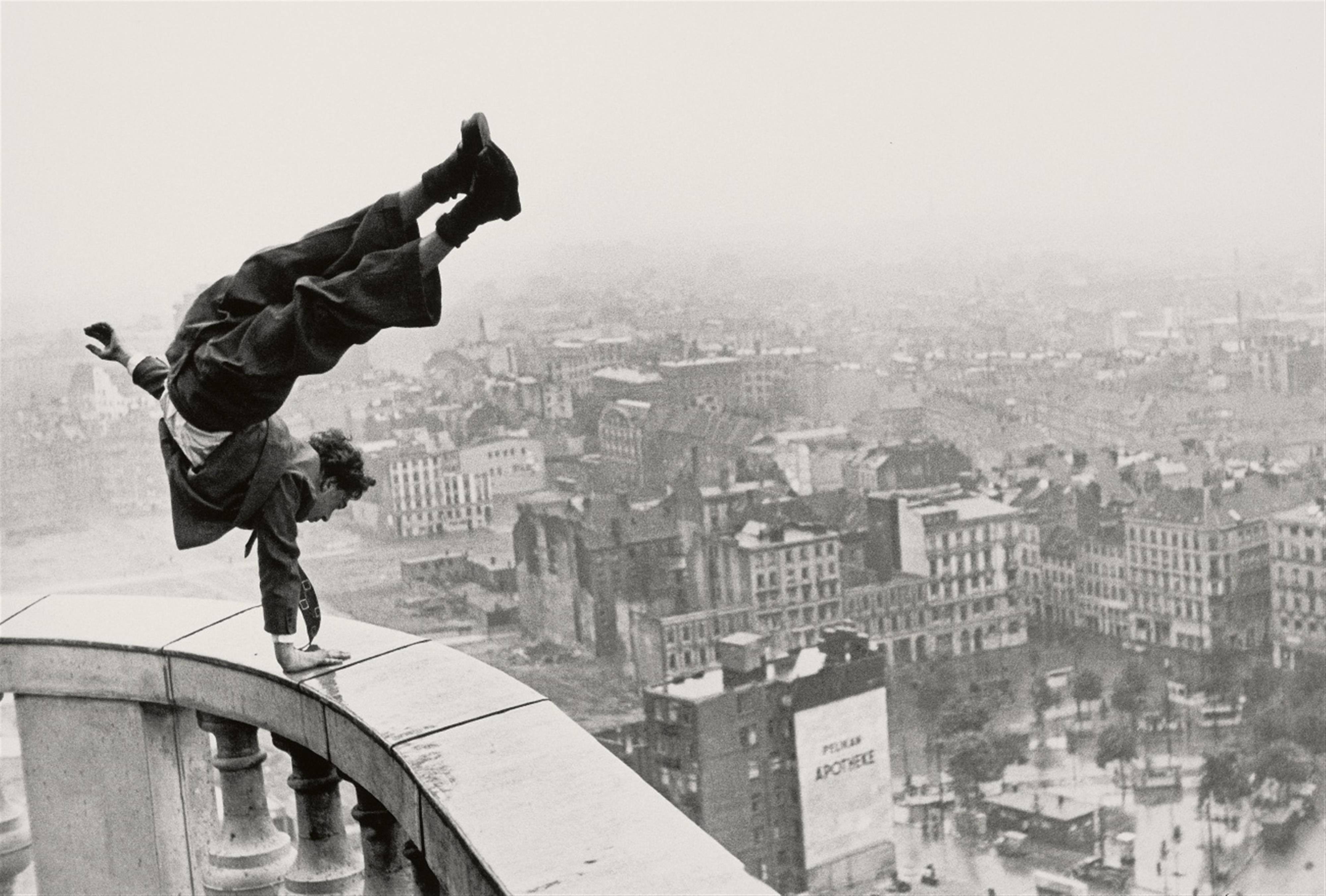 Jürgen Schadeberg - Hans Prignitz makes a Handstand on the Hamburg Michel