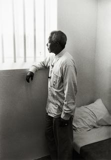 Jürgen Schadeberg - Nelson Mandela in his cell on Robben Island (revisit), 1994