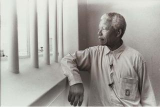 Jurgen Schadeberg - Nelson Mandela in his Cell on Robben Island (Revisit)