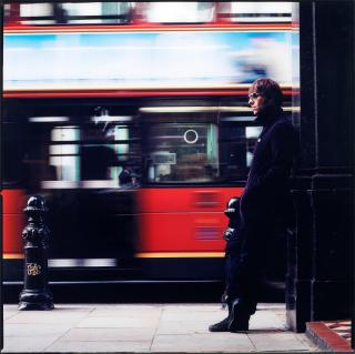 Lawrence Watson - Liam Gallagher with London bus, London, 1990s, printed later