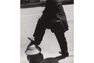 Leon Levinstein - NYC [man resting his foot on a fire hydrant]