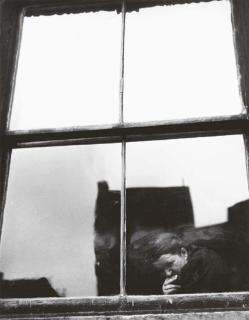Leon Levinstein - Untitled (Figure at a window)