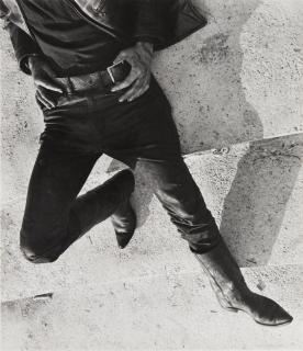 Leon Levinstein - Untitled [man in cowboy boots resting]