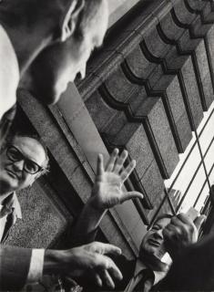Leon Levinstein - Untitled, New York [street scene, men with hands raised]
