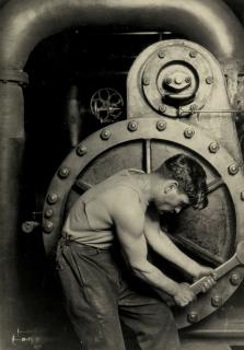 Lewis W. Hine - Mechanic at steam pump in electric power house, 1921