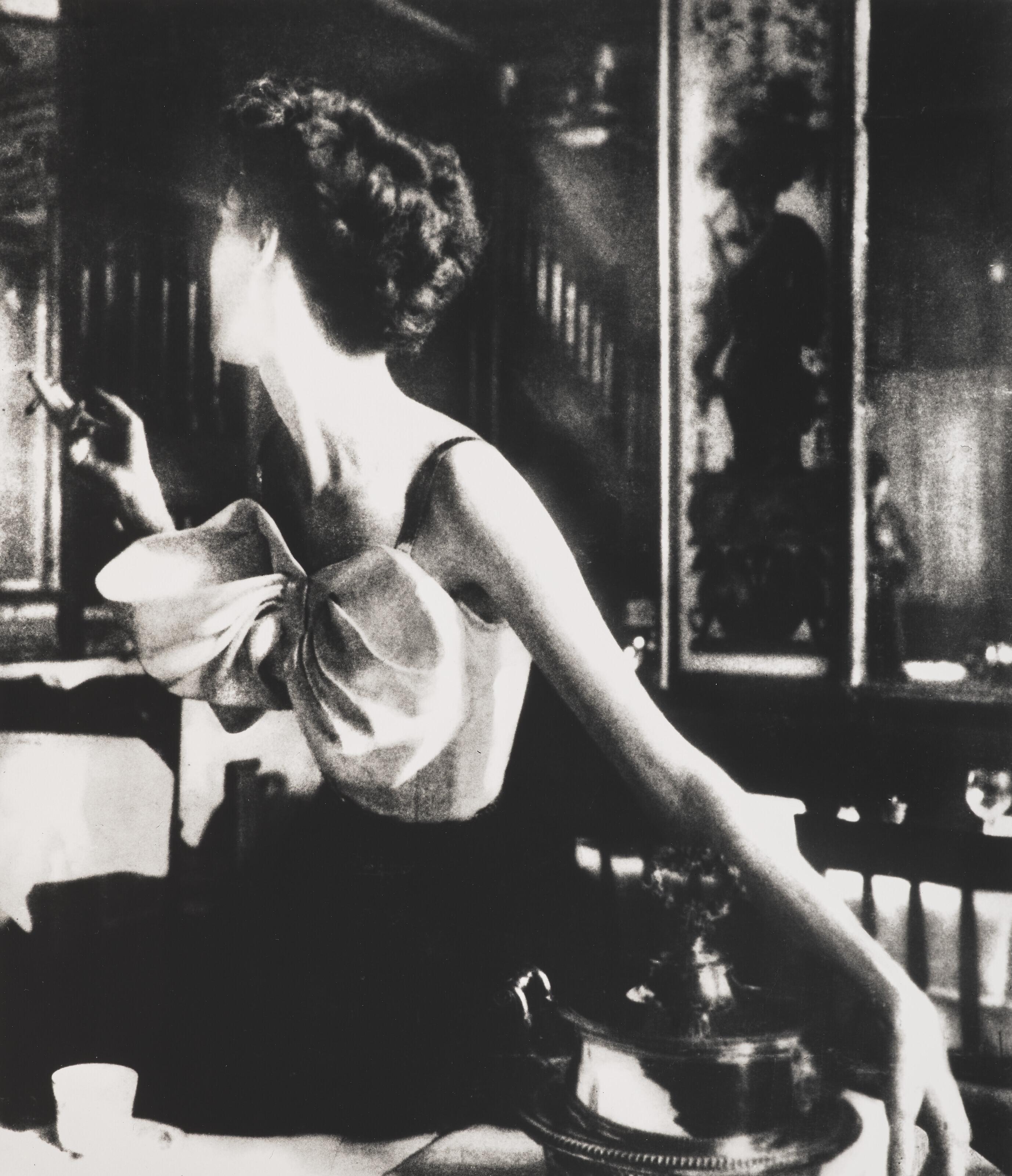 Lillian Bassman - Across the Restaurant, Barbara Mullen, dress by Jacques Fath, Le Grand Véfour, Harper\'s Bazaar, Paris, 1949