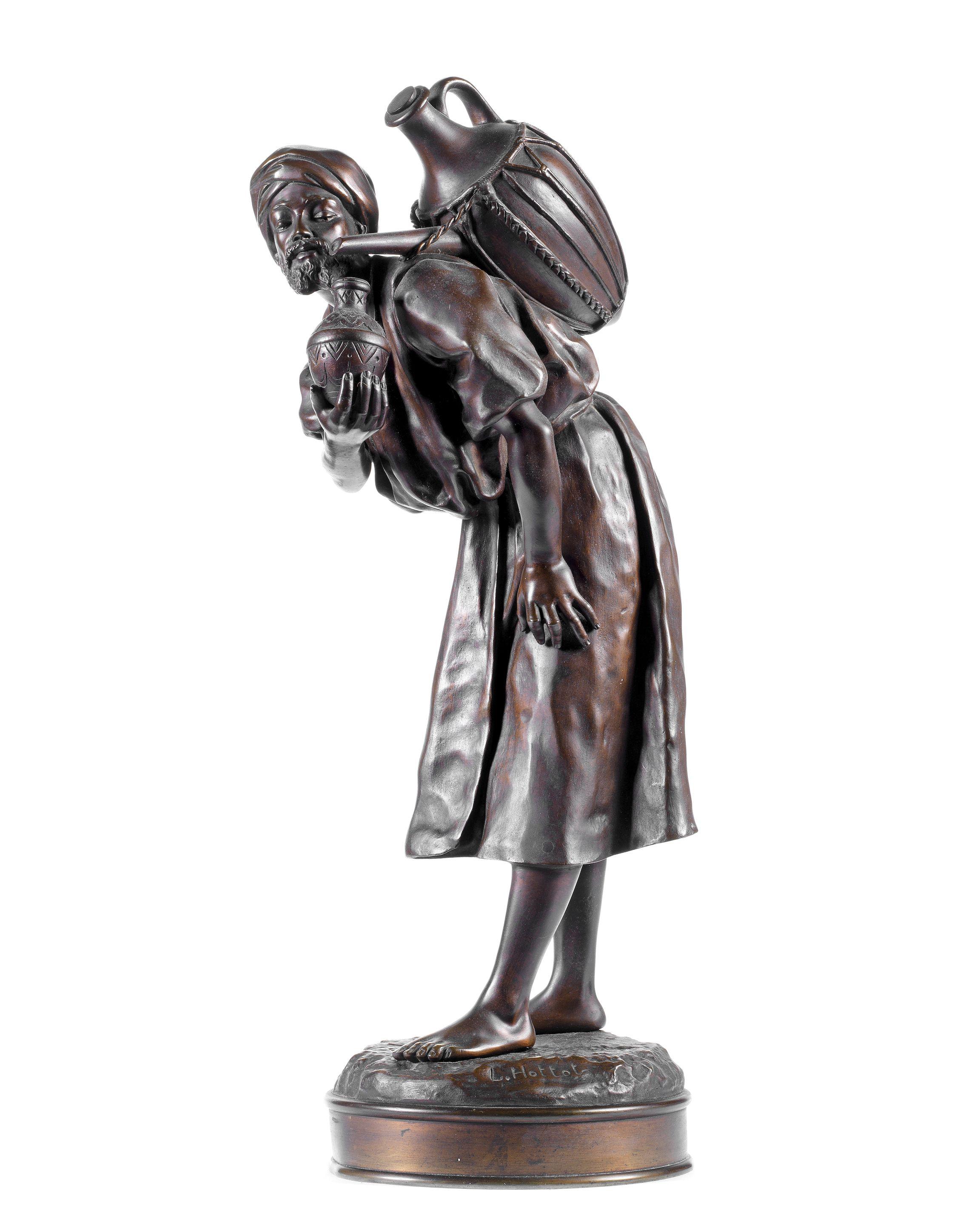 Louis Hottot - A patinated bronze figure of an eastern water carrier