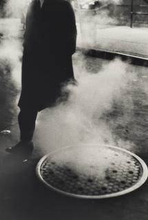 Louis Stettner - Man Near Manhole, Broadway, NYC, 1954