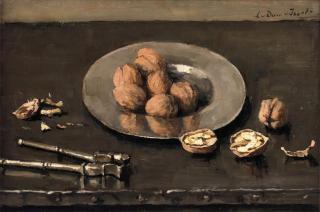 Lucie Van Dam Van Isselt - A still life with walnuts on a pewter plate