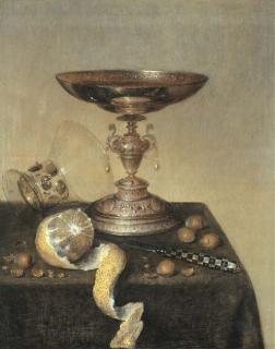 Maerten Boelema De Stomme - A silver tazza, an upturned roemer, a partly-peeled lemon, a knife and hazelnuts on a draped table