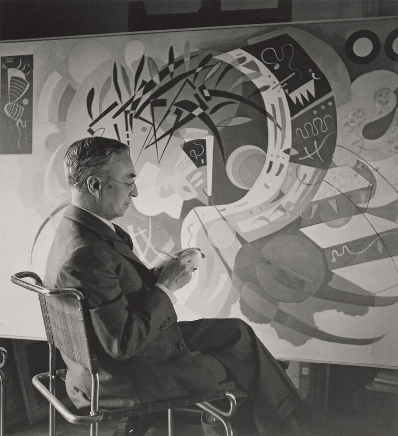 Kandinsky in front of his painting Dominant Curve (Courbe dominante, 1936), 1936.