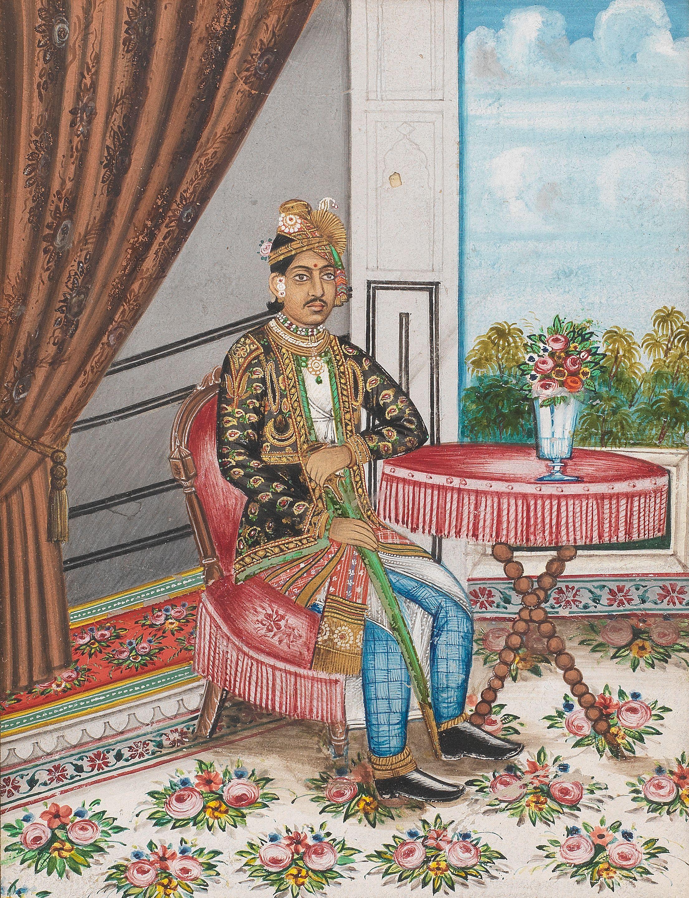 Maharajah Madan Singh of Kishangarh (reg. 1900-26), seated at a table in a palace interior