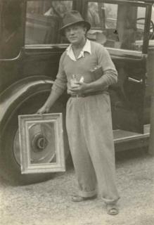 Man Ray - Picasso Jouant À Encadrer La Roue De L\'Hispano-Suiza, Mougins, France, 1937